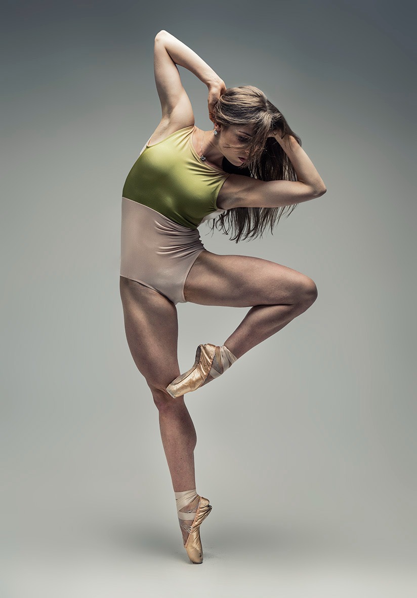Hannah Martin performing a ballet pose in the studio